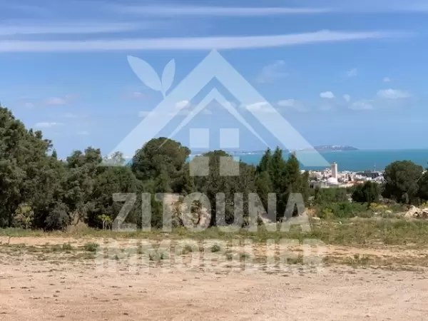 A vendre un terrain de 1300 m2 ayant une superbe vue la montagne de bougarnin et vue sur mer