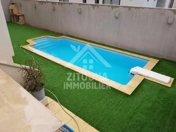 A louer un appartement avec piscine dans un quartier résidentiel gardée aux les jardins de carthage (3802)